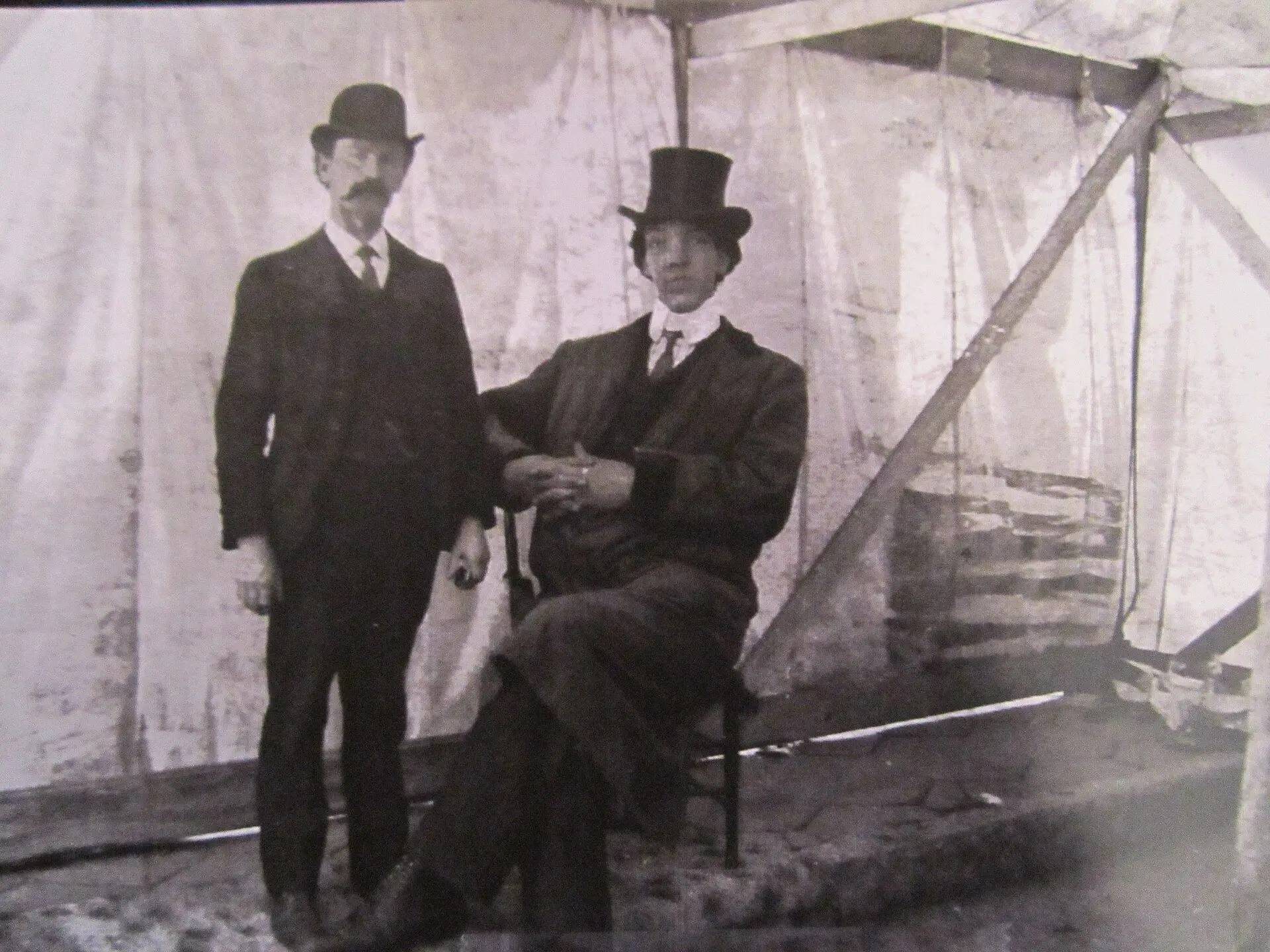 Two men posed in a circus tent (Edouard Beaupré with manager Joseph Patenaude)